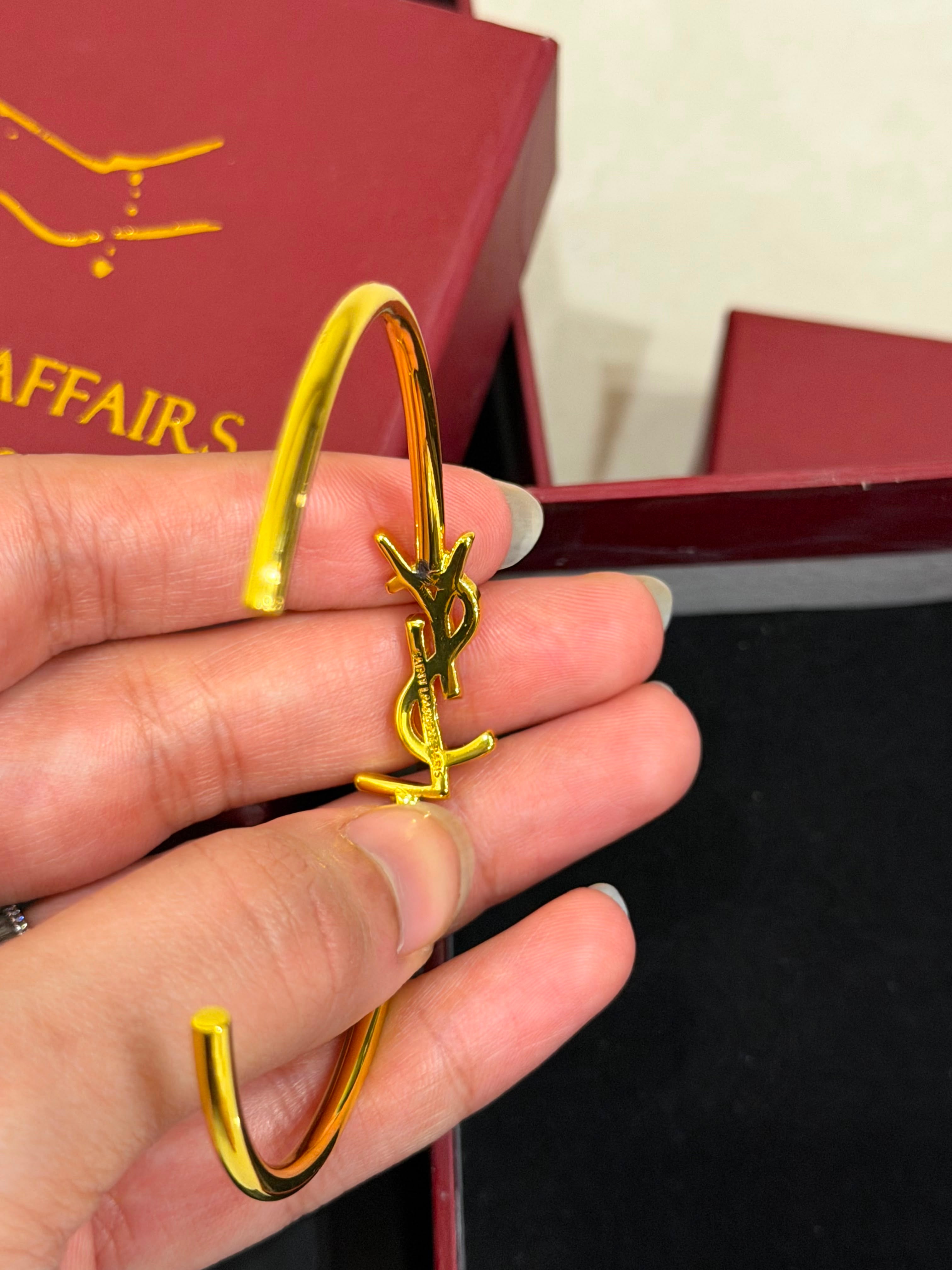 Y$L Cassandre Logo Bangle – Gold Finish (WITHOUT BRAND PACKAGING)