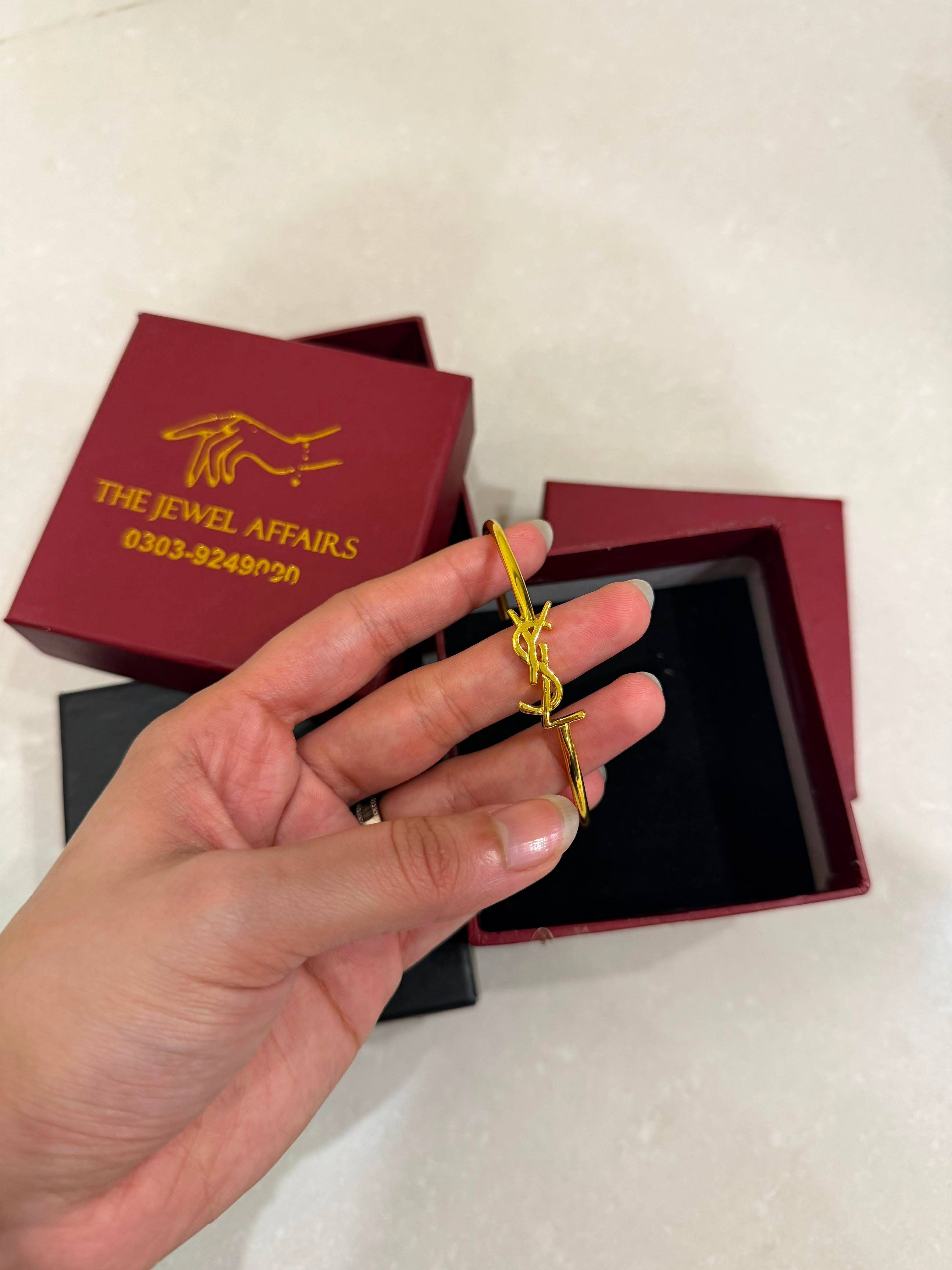 Y$L Cassandre Logo Bangle – Gold Finish (WITHOUT BRAND PACKAGING)