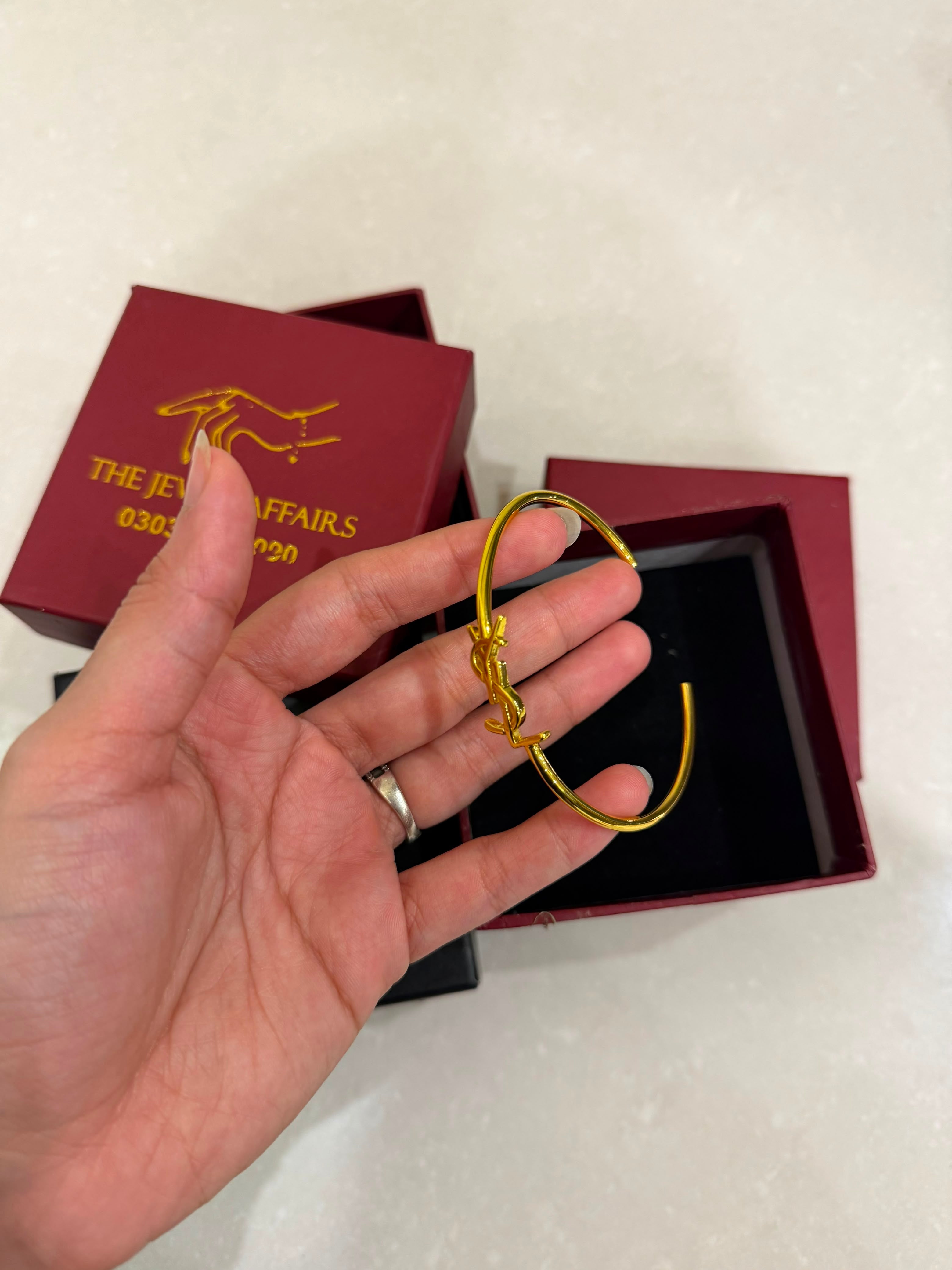Y$L Cassandre Logo Bangle – Gold Finish (WITHOUT BRAND PACKAGING)